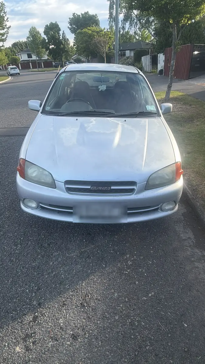 Silver 1996 Toyota Starlet hatchback parked on a Bishopdale street