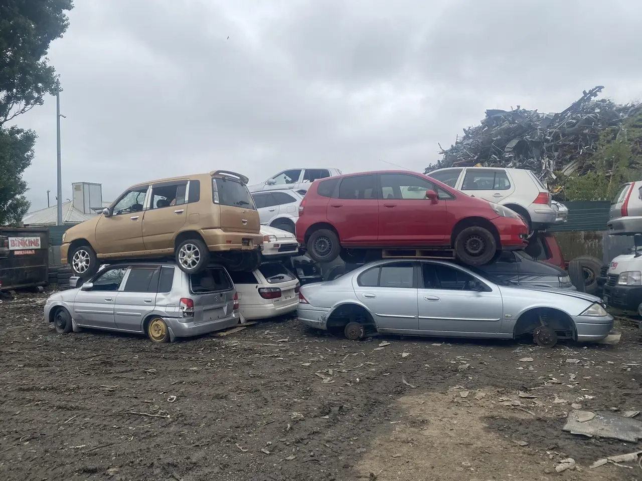 Four cars lined up ready to be dismantled